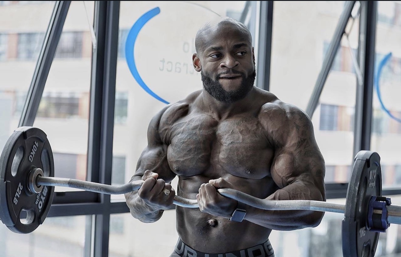 Tim Jones, Swole Fitness coach, training with a barbell in the gym